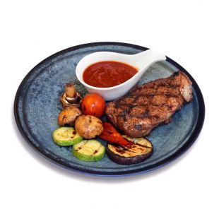 Стейк зі свинини та овочами гриль